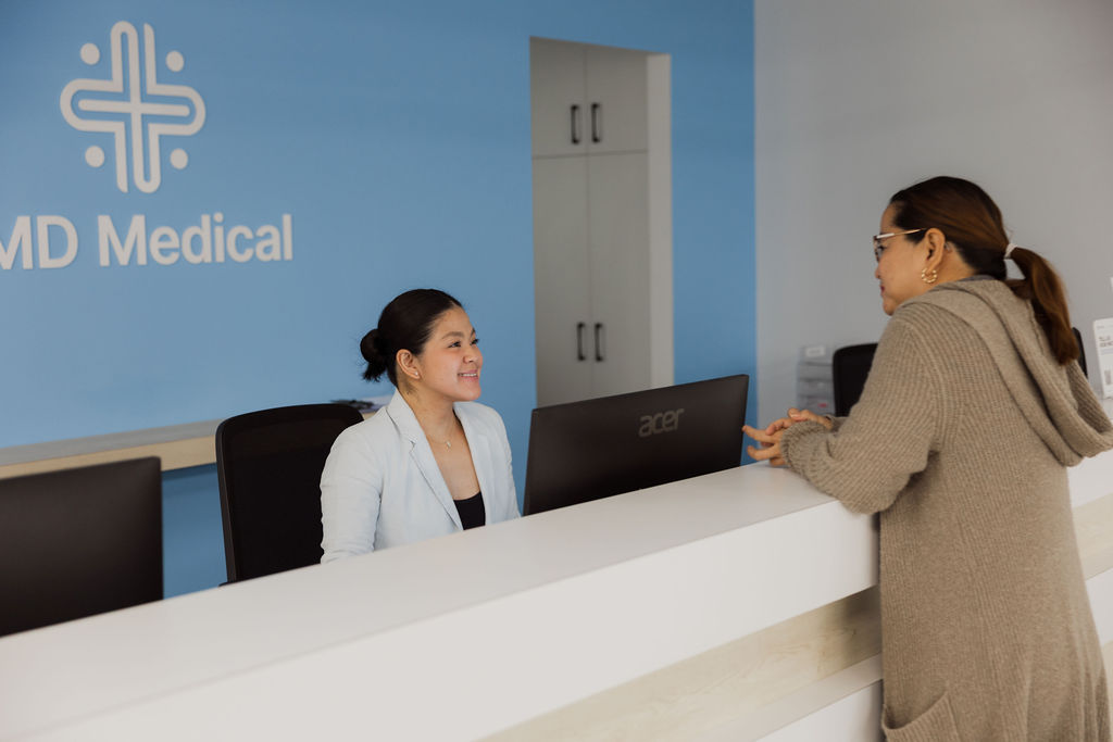 IMD Medical Attendant talking to patient